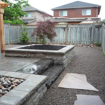 back yard patio , pergola, planter, natural stone stepping stones