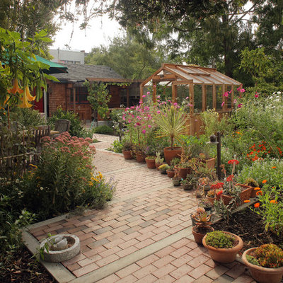 This is an example of a large rustic full sun backyard brick garden path in San Francisco.