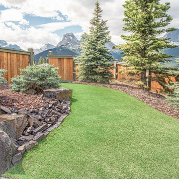 Backyard Exit with Artificial Grass, Rundle Stone Tailings & Bark Nuggets