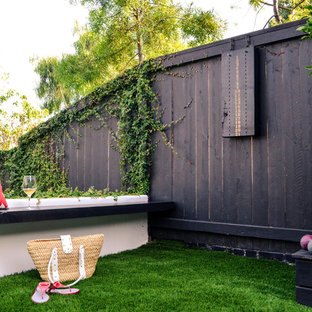 Design ideas for a huge mediterranean drought-tolerant and partial sun side yard outdoor playset in Los Angeles with decking.
