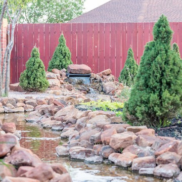 Backyard Oasis with Expansive Water Feature