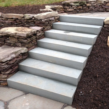 Backyard Patio and Natural stone retaining walls with stairs