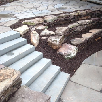 Backyard Patio and Natural stone retaining walls with stairs