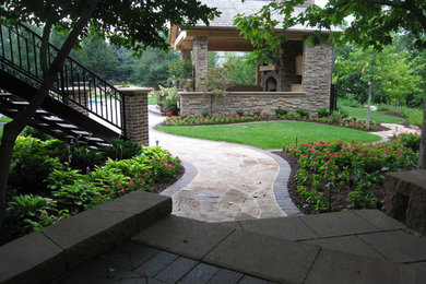 Design ideas for a large transitional partial sun backyard stone garden path in Omaha for summer.