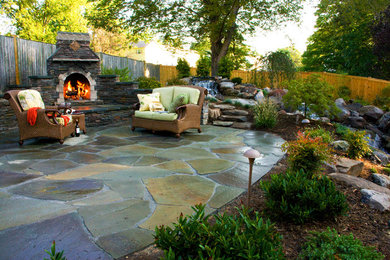 Inspiration for a large timeless backyard stone patio fountain remodel in DC Metro