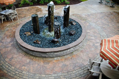 Design ideas for a modern courtyard brick water fountain landscape in Minneapolis.