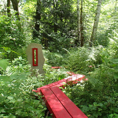 This is an example of an eclectic garden path in Seattle with decking.