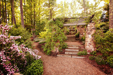 Photo of a huge traditional partial sun hillside stone garden path in Charlotte for spring.