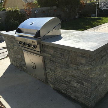 BBQ with real stone veneer and concrete counter top