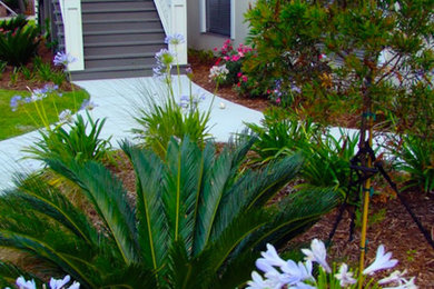 Design ideas for a side yard concrete paver landscaping in Other.