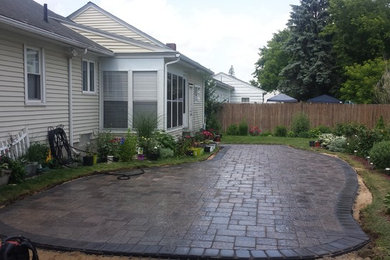Inspiration for a mid-sized modern full sun backyard concrete paver landscaping in Portland Maine for summer.
