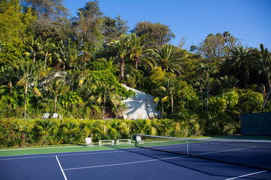 World-inspired partial sun garden in Orange County with an outdoor sport court.