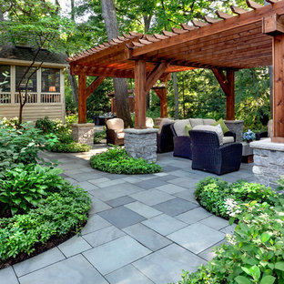 Inspiration for a large traditional shade backyard stone garden path in Chicago for summer.