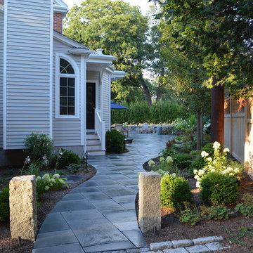 Bluestone patio entrance with granite posts.