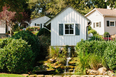 Photo of a farmhouse garden in Other with a water feature.