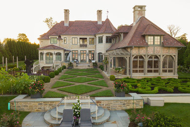 Inspiration for a huge traditional full sun front yard gravel formal garden in Other for spring.