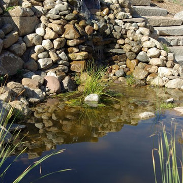 Boulder wall and pond