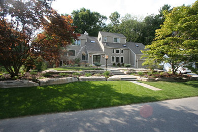 Design ideas for a large contemporary partial sun front yard concrete paver landscaping in Boston for spring.