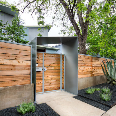 Design ideas for a mid-sized contemporary full sun and drought-tolerant front yard concrete paver landscaping in Austin.