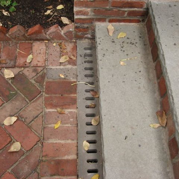 Brick and bluestone steps with custom bluestone strip drain detail