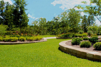 Design ideas for a large contemporary partial sun front yard brick landscaping in Houston.