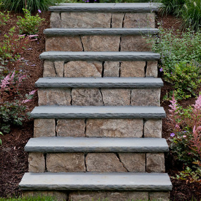 Inspiration for a traditional hillside stone landscaping in Boston.