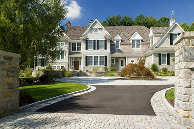 Photo of a mid-sized victorian full sun front yard stone driveway in Philadelphia.