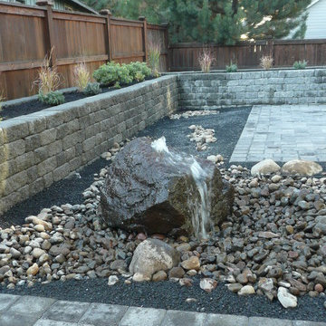 Bubbling boulder in paver patio
