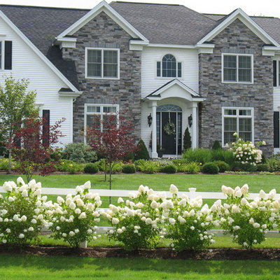 Inspiration for a large traditional full sun front yard mulch formal garden in Burlington.