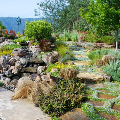 Inspiration for a traditional full sun stone water fountain landscape in San Francisco.