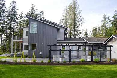 Large contemporary side full sun garden for summer in Seattle with a vegetable patch and gravel.