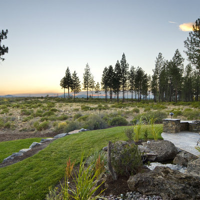Design ideas for a huge traditional backyard landscaping in Seattle.