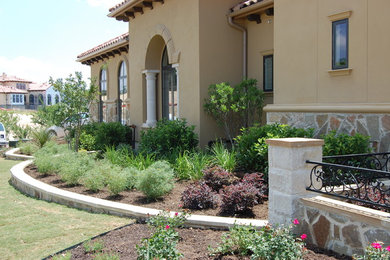 Photo of a mid-sized mediterranean full sun side yard landscaping in Austin.