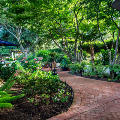 Photo of a large mediterranean shade backyard brick landscaping in San Francisco for summer.