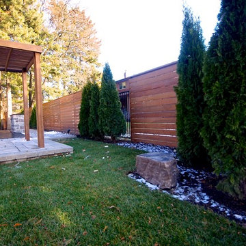 Cedar Deck, Interlocking Stone, Privacy Fencing and Greenery