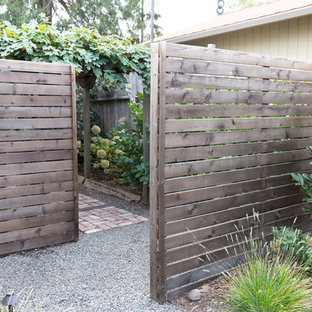 This is an example of a mid-sized transitional drought-tolerant and full sun front yard gravel garden path in Other.