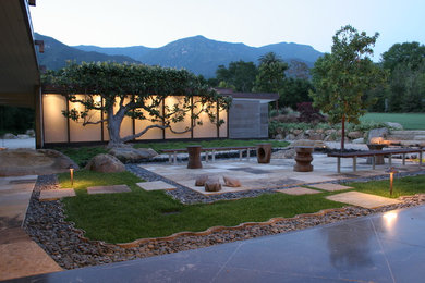 Design ideas for a large modern backyard stone landscaping in Santa Barbara.