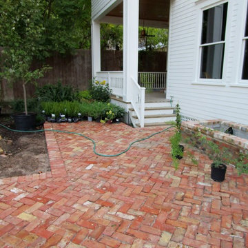Charming  cottage garden and old bricks for a new ribbon driveway and patio.