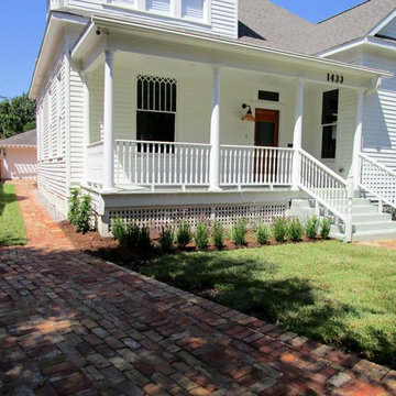 Charming  cottage garden and old bricks for a new ribbon driveway and patio.