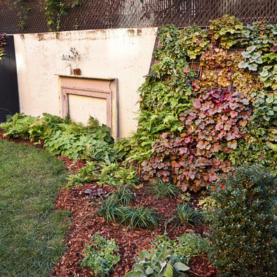 This is an example of a mid-sized rustic partial sun backyard brick formal garden in New York for summer.