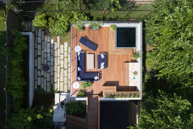 Photo of a small modern partial sun backyard landscaping in Boston with decking for summer.