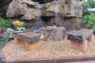 Inspiration for a traditional backyard gravel water fountain landscape in New York.