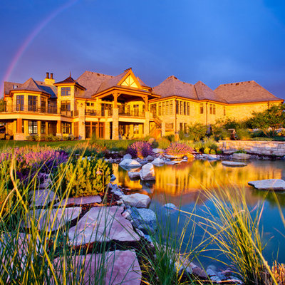 Design ideas for a large traditional full sun backyard stone landscaping in Denver.