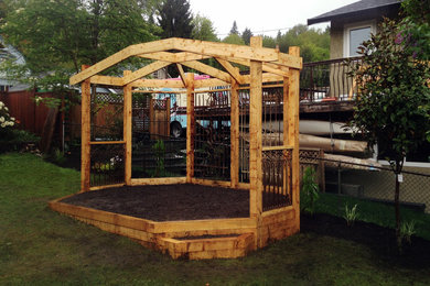 Inspiration for a small rustic partial sun backyard mulch vegetable garden landscape in Vancouver for spring.