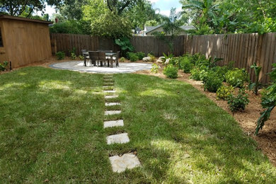 Design ideas for a medium sized traditional back partial sun garden in Orlando with concrete paving.