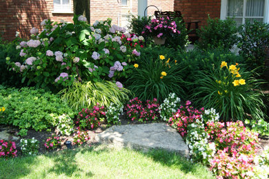 Inspiration for a mid-sized eclectic partial sun backyard formal garden in Detroit.