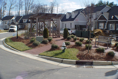 This is an example of a traditional full sun front yard landscaping in Raleigh.