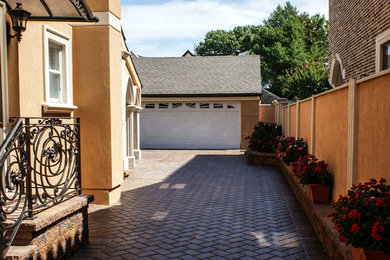 Design ideas for a mid-sized traditional front yard driveway in New York.