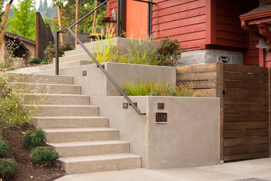 This is an example of a mid-sized modern drought-tolerant and partial sun front yard concrete paver garden path in Other.