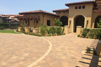 Inspiration for a traditional front yard concrete paver landscaping in San Diego.
